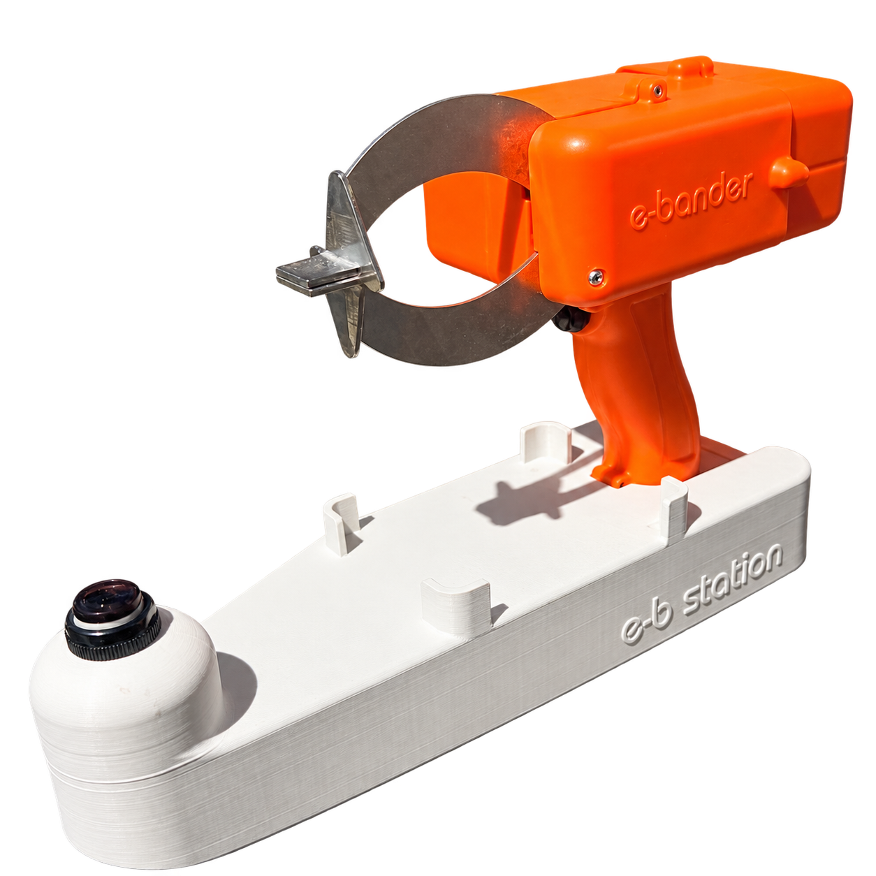 Orange e-bander fitted in the white base station beside its sensor